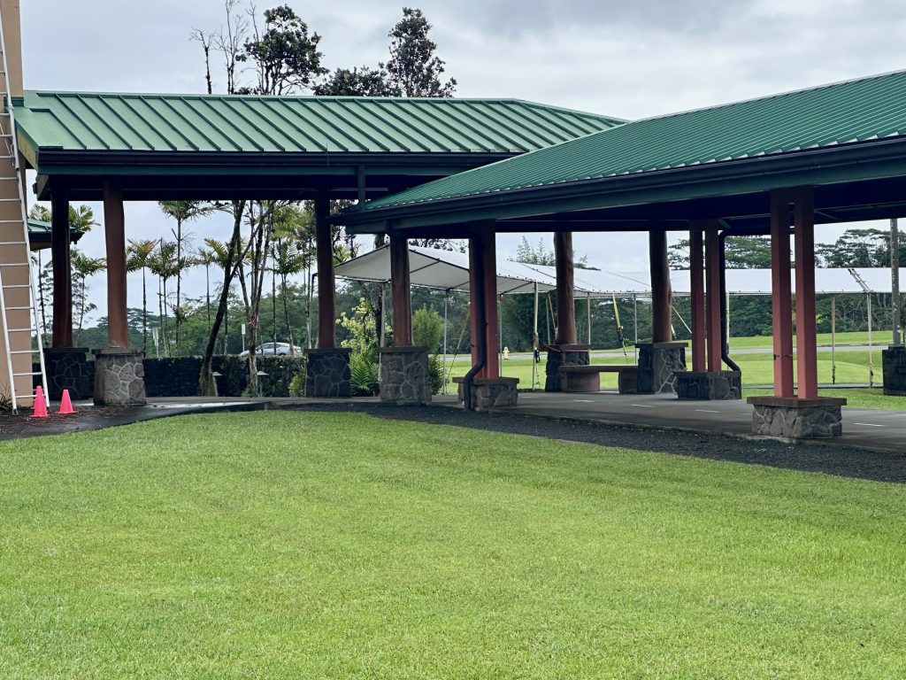 Photo of the Ohia post lined walkway to the Kamehameha High School Chapel.