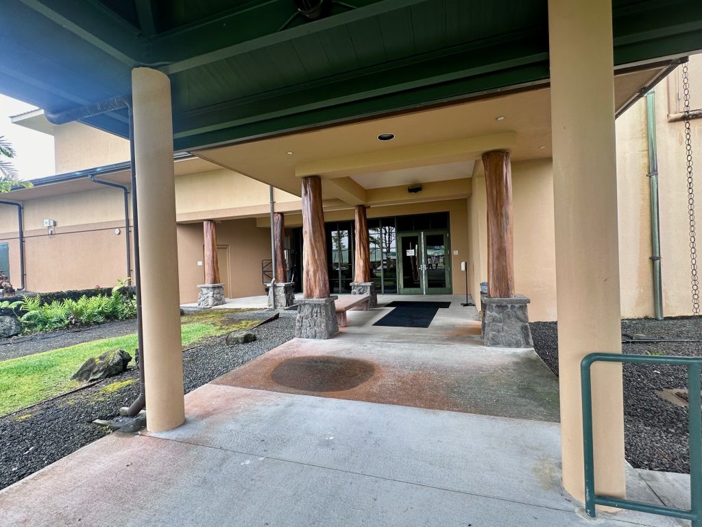 Photo of the Ohia post lined walkway to the Kamehameha High School Chapel.